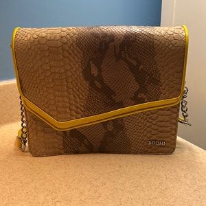 Snakeskin Bodhi crossbody with yellow detail.
